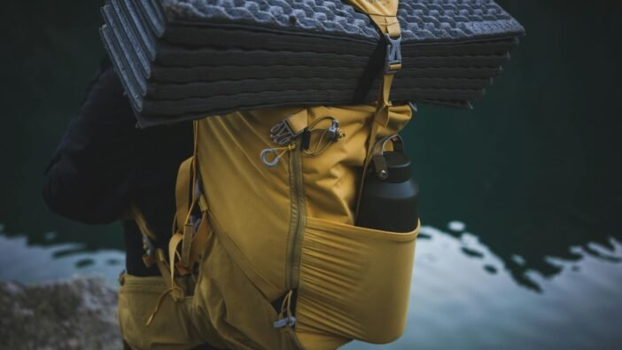 water bottle on a person s backpack