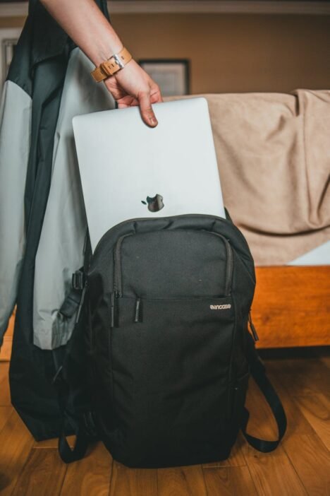 a person holding a laptop